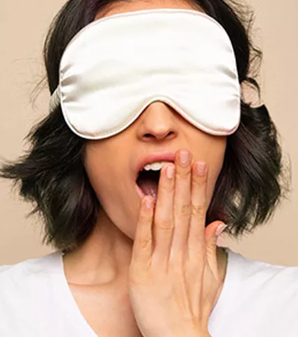 Woman wearing sleep mask